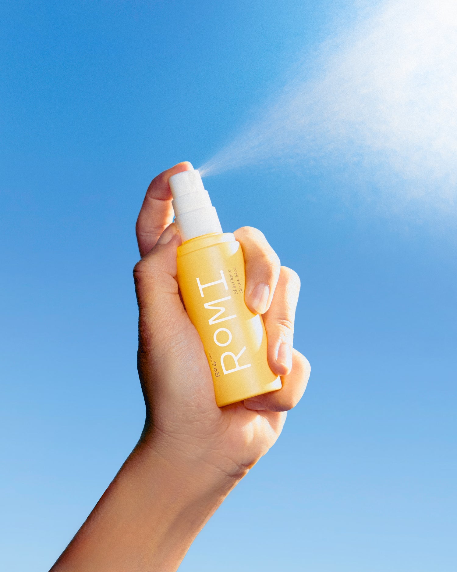 ROMI Beauty Skin Oasis Serum Mist bottle, 3-in-1 toner, serum, and face mist for hydrated skin.