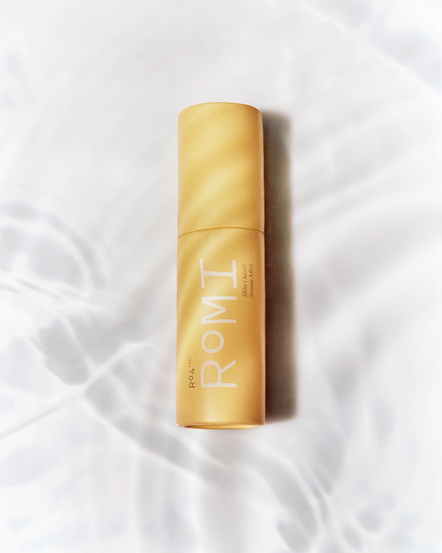 ROMI Beauty Skin Oasis Serum Mist bottle, 3-in-1 toner, serum, and face mist for hydrated skin.