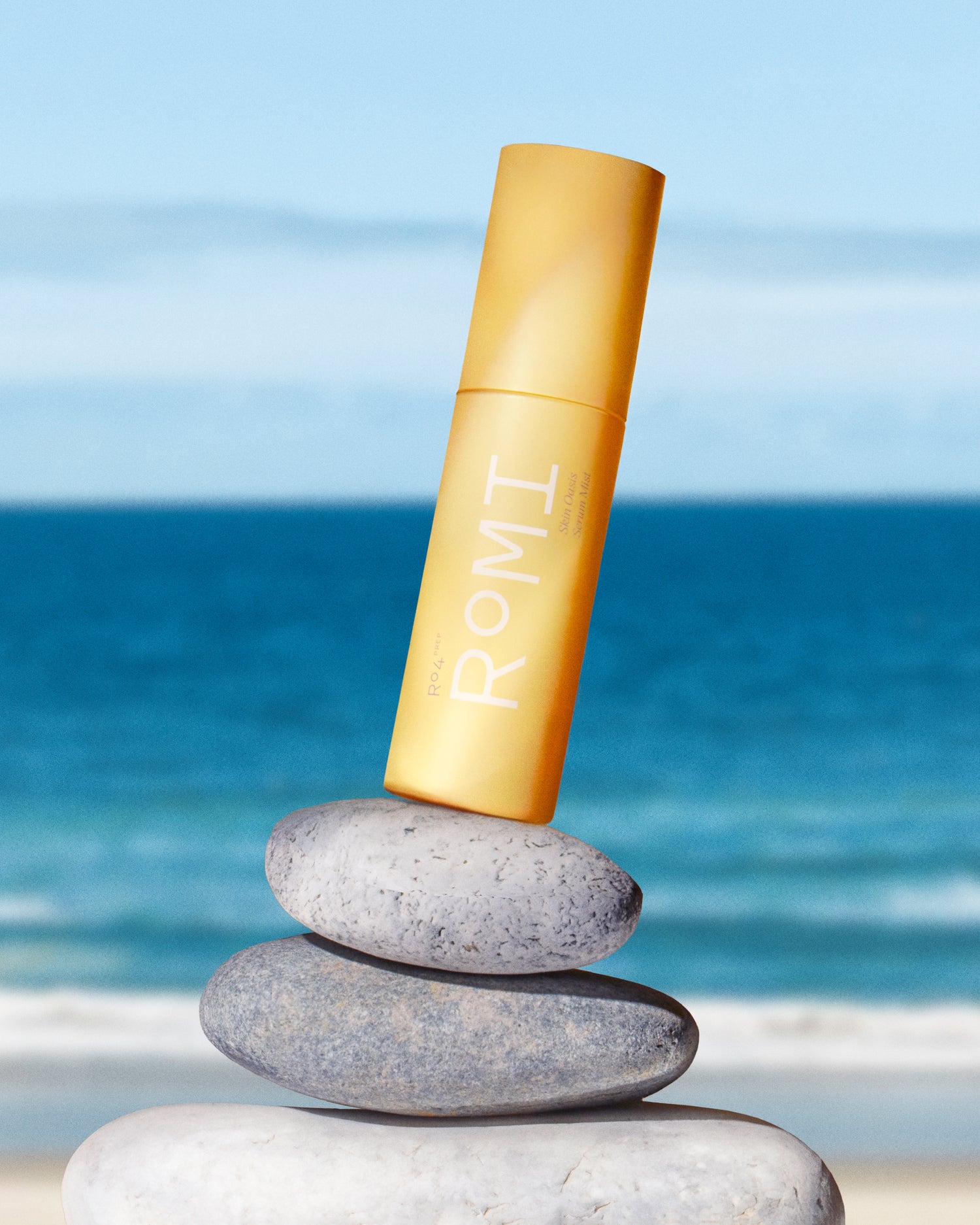 ROMI Beauty Skin Oasis Serum Mist bottle, 3-in-1 toner, serum, and face mist for hydrated skin.